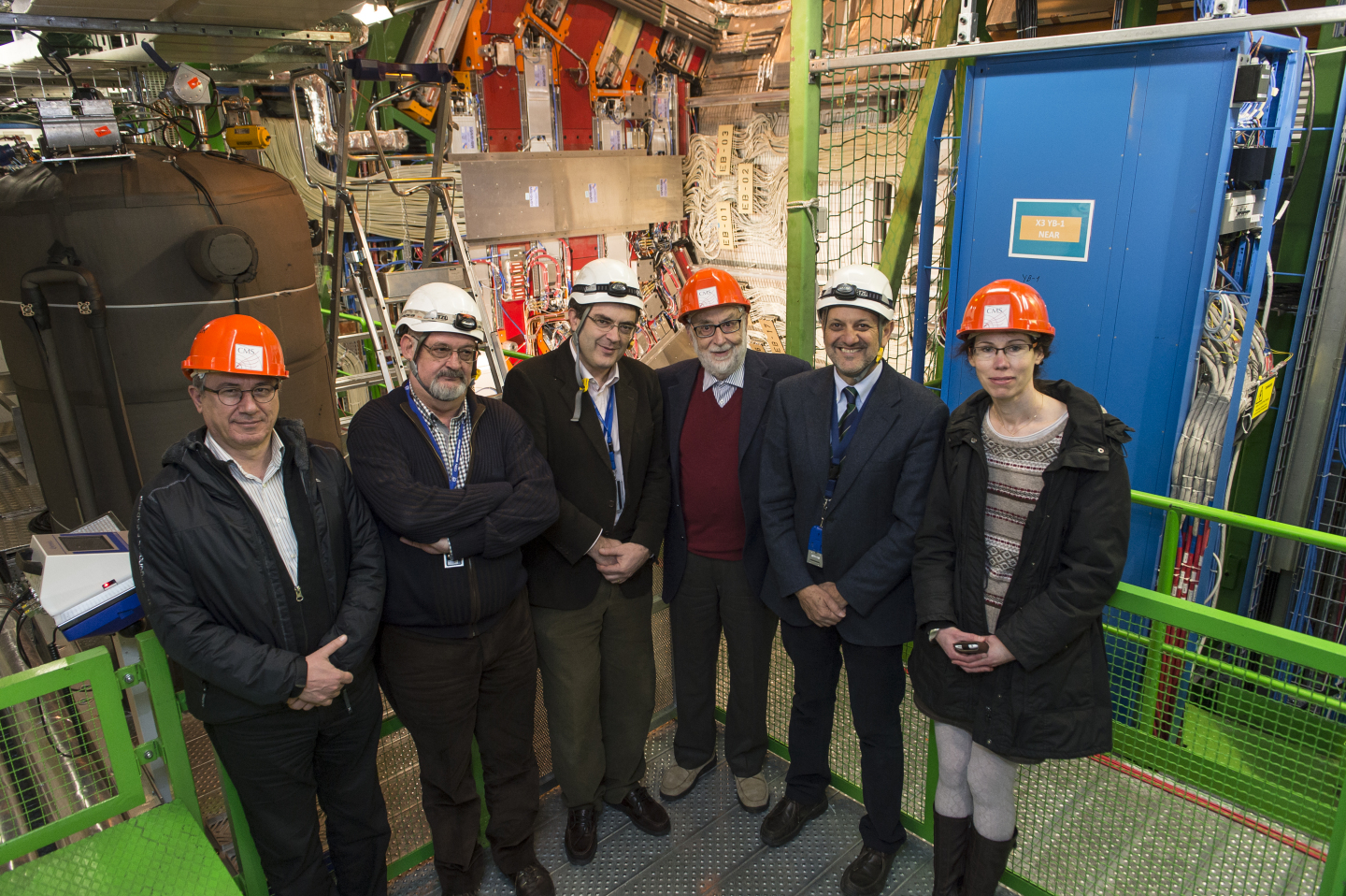 Professor Englert (orange hat, centre) in the underground cavern with the CMS detector