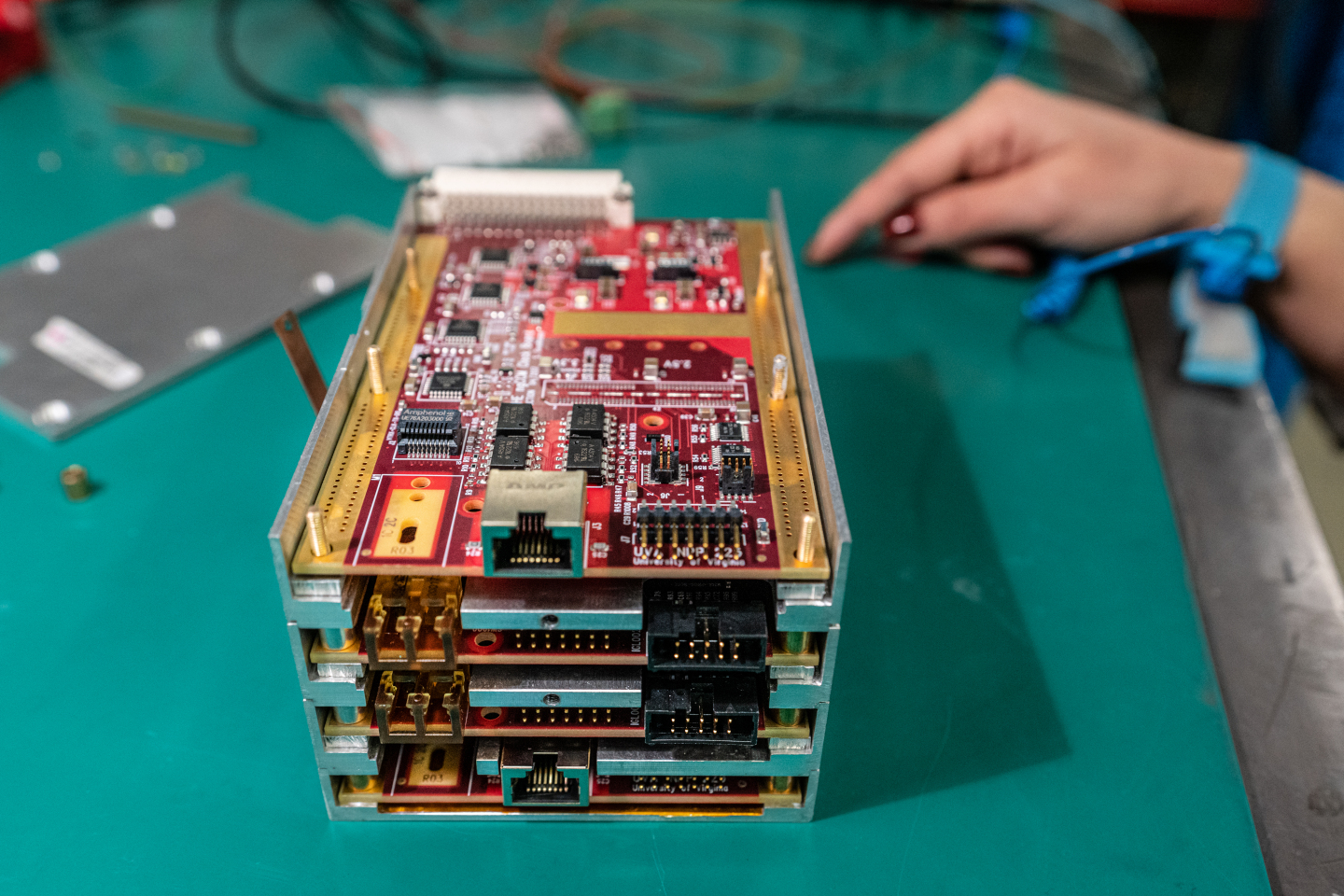 Open HCAL Endcap next-generation Clock, Control, and Monitoring unit (HEngCCM). Built of four printed circuit boards (PCBs), the HE ngCCMs feature two clock (outermost) and two control (innermost) boards. Credit: S.J. Hertzog, CERN