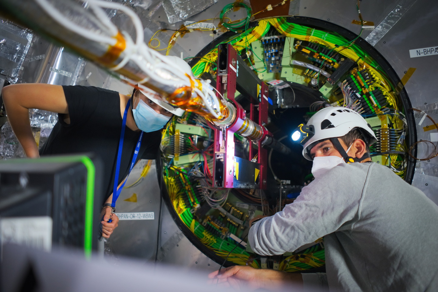 Joanna Wanczyk (left) and Georg Auzinger (right) work on the -Z side bulkhead platform. Credits: A.G. Delannoy